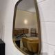 Mirror, rear-view and free form in brass.