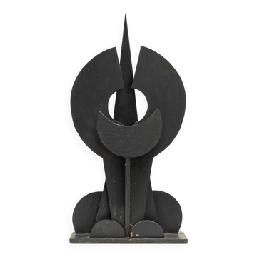 Black brutalist wooden sculpture