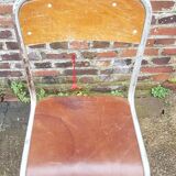 Chaise vintage datée 1955 assise en cuir