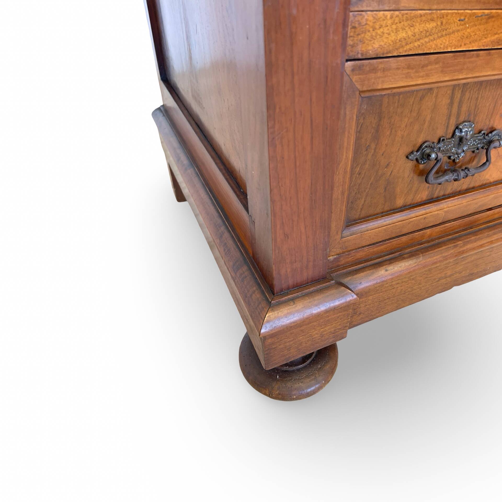 Antique walnut commode with bronze handles in the shape of a lion's mask,