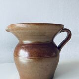 Old pitcher in glazed terracotta