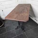 Table de bistrot pieds en fonte dessus en bois massif