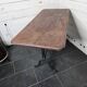 Bistro table with cast iron legs and solid wood top