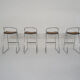 Set of four chrome and cane bar stools, 1970's