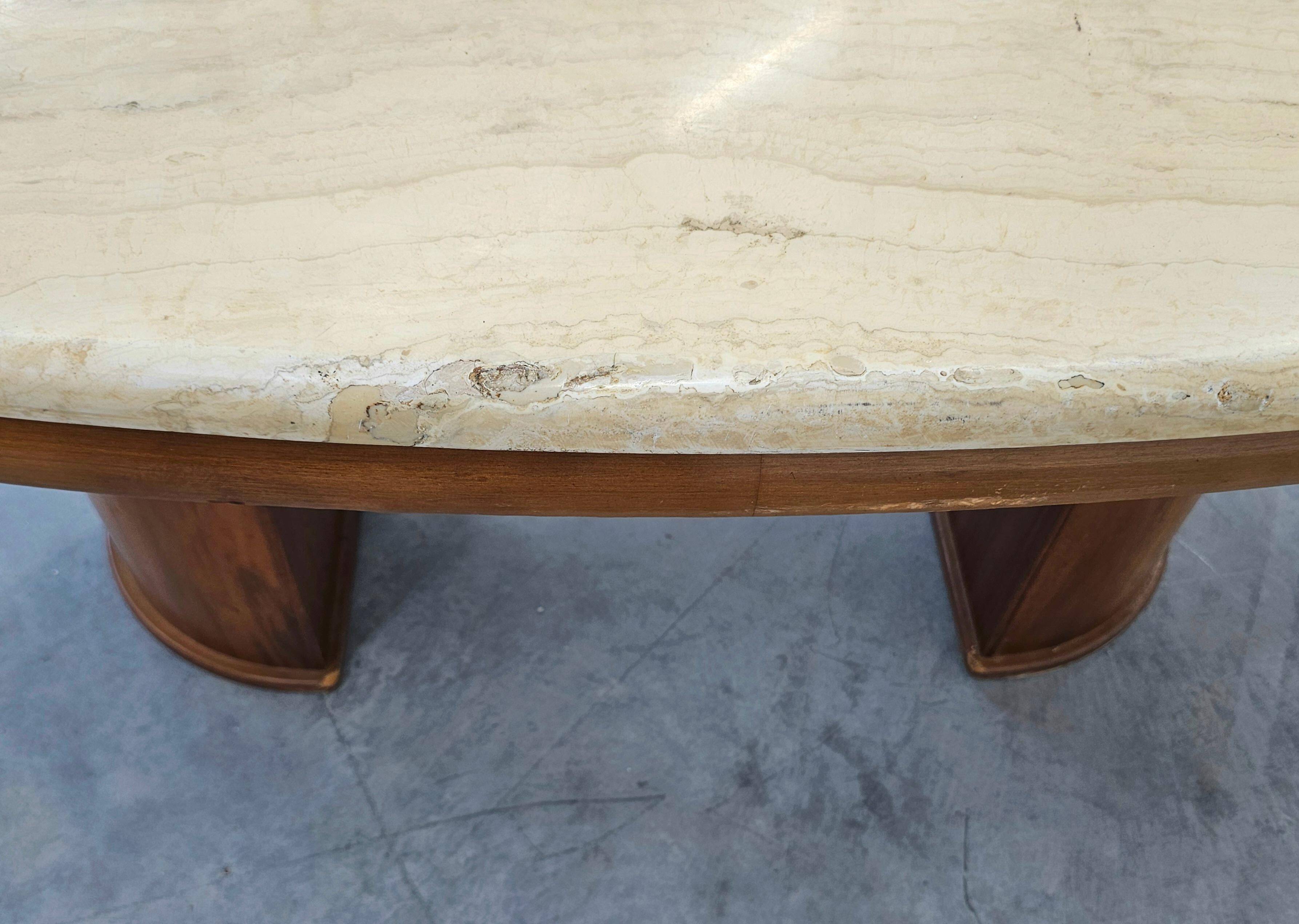 Mid-century coffee table in walnut with a travertine top.