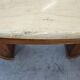 Mid-century coffee table in walnut with a travertine top.