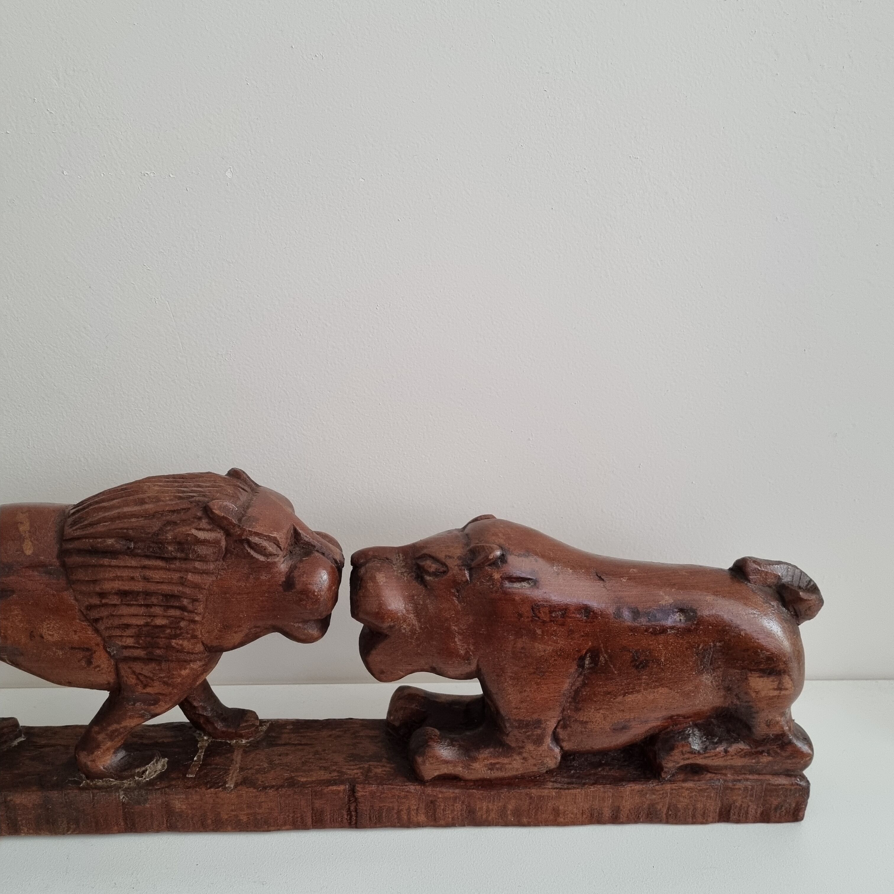 Lion and hippopotamus wood sculpture