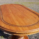 Oval dining table in solid teak