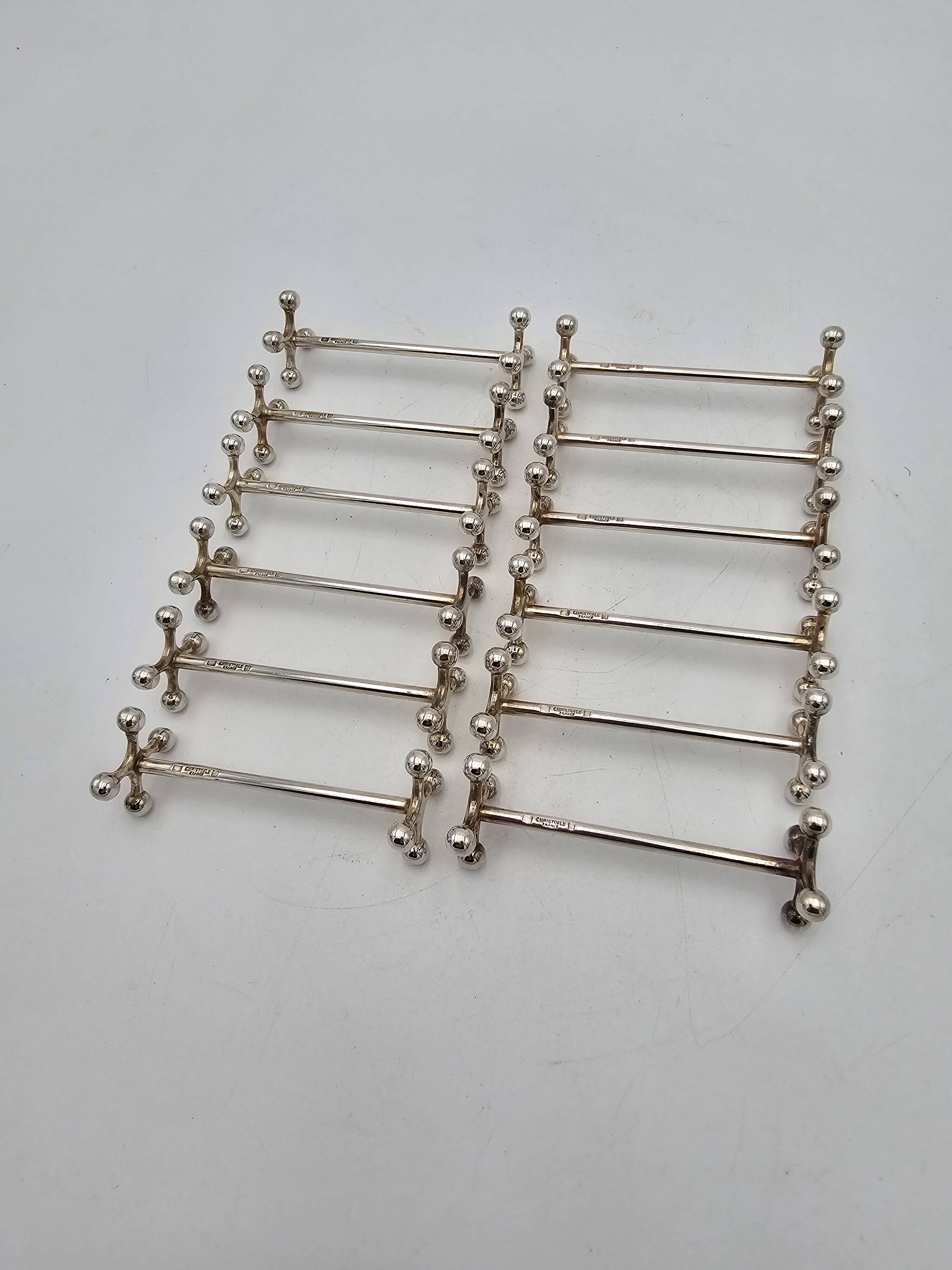 12 Christofle silver-plated knife holders