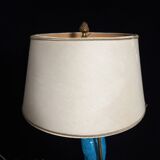 Large table lamp with earthenware peacock and beige silk lampshade