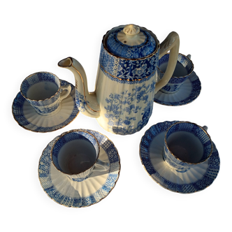 Old coffee service Lunéville with blue lace decoration.