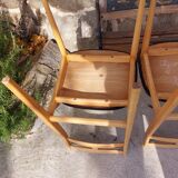 5 Scandinavian style chairs, wood and black faux leather.