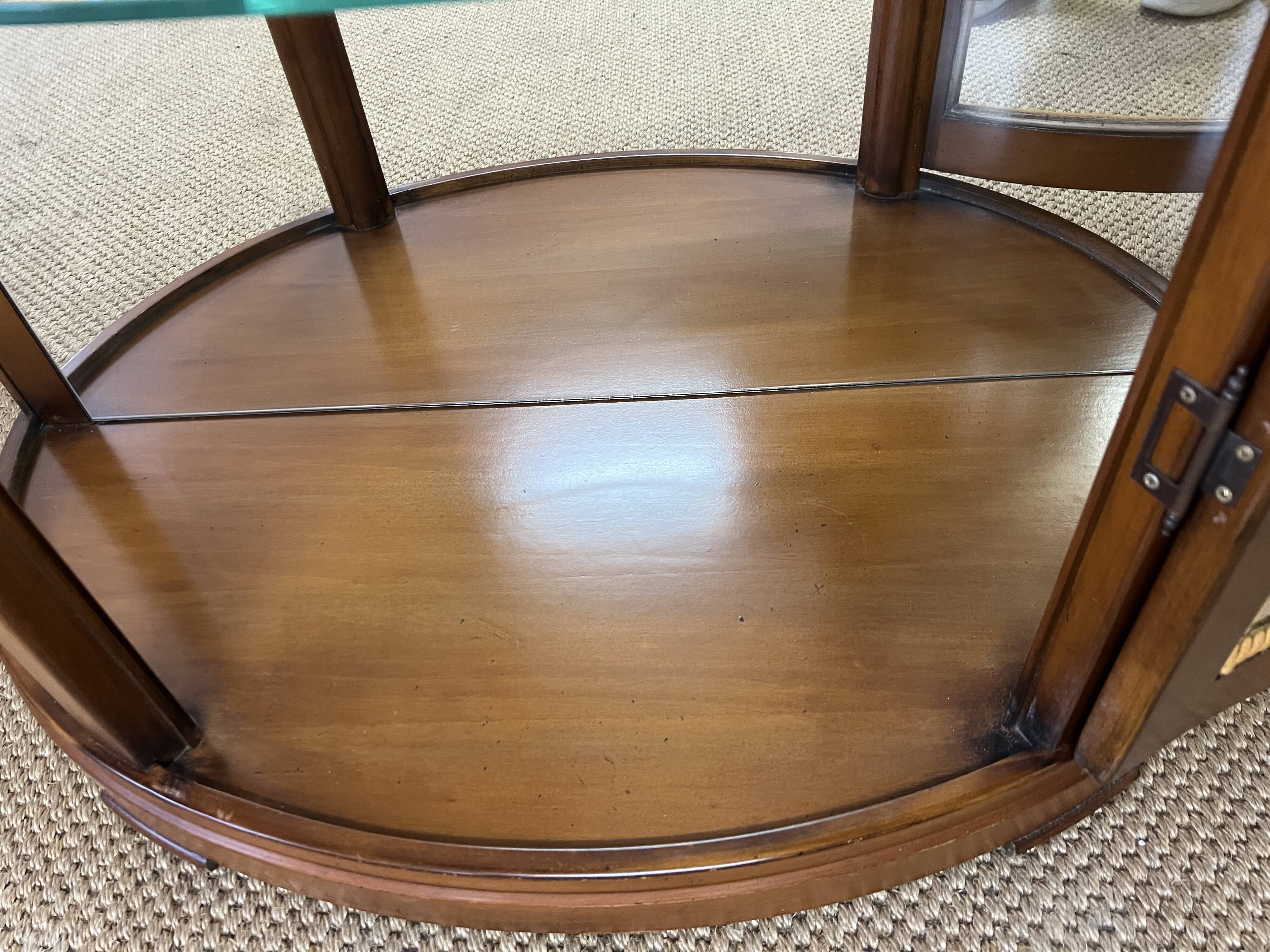 Wooden display case and half-moon mirror