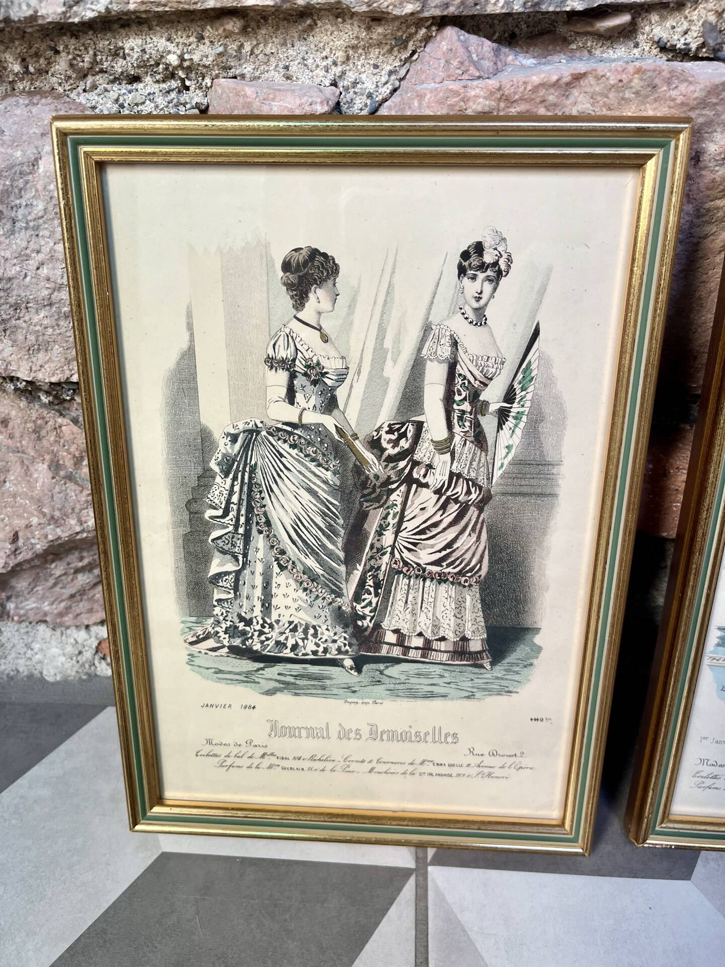 Pair of framed fashion engravings from the 19th century.