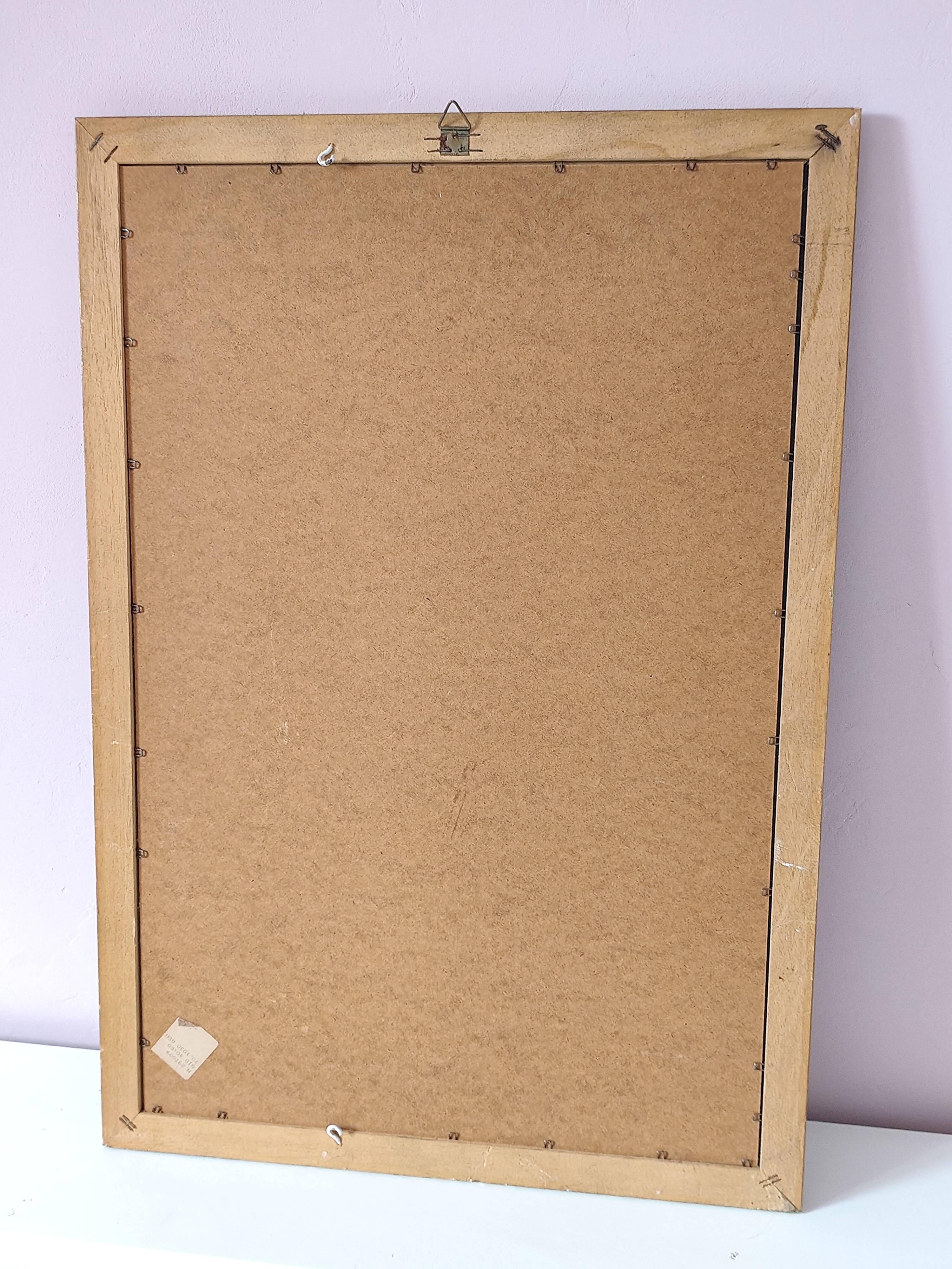 Rectangular gold mirror with bevelled glass.