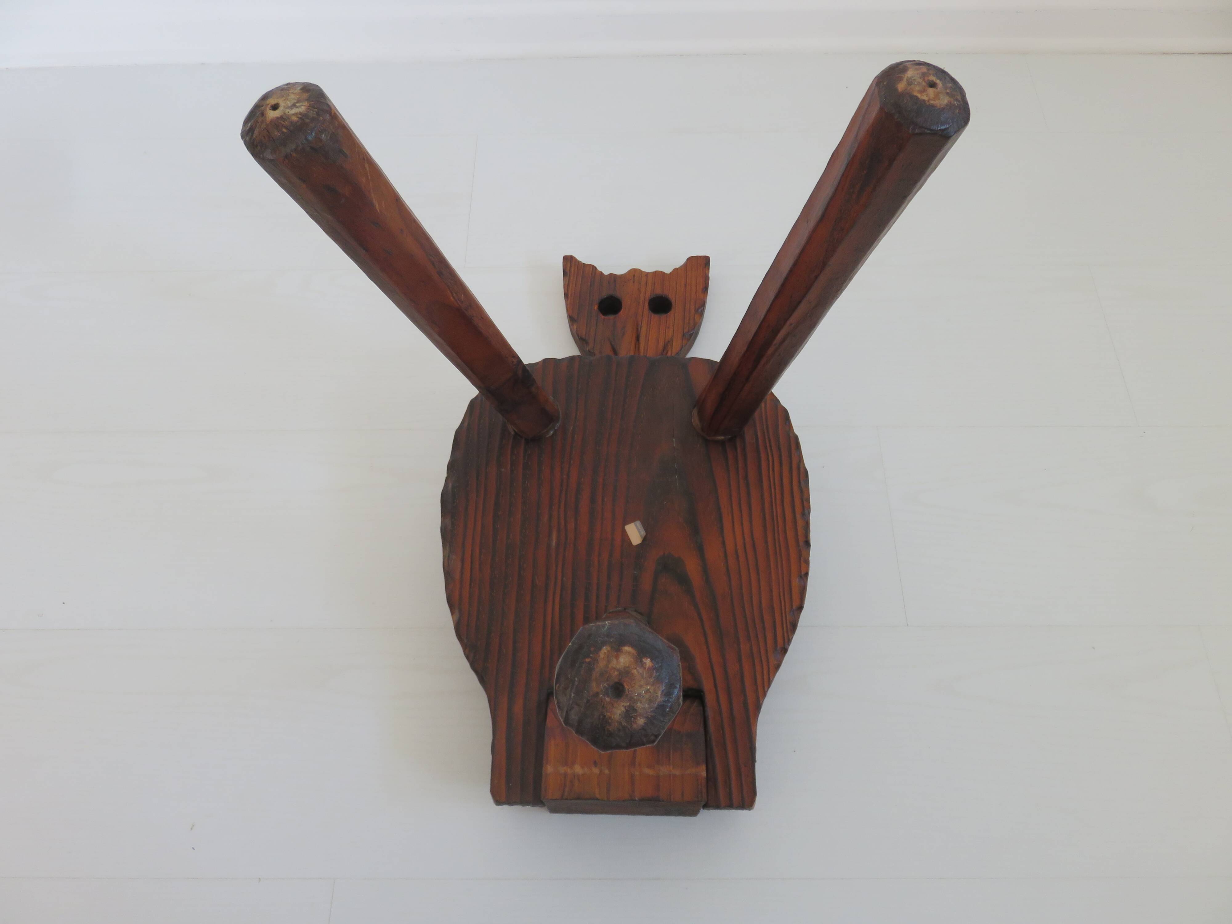 Brutalist cowhide tripod stool in solid wood