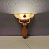 Wall lamp, where the base is a carved wooden lady holding the shade which is made of alabaster 1920s