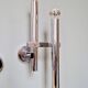 Pair of chromed metal wall lights, design Gaetano Sciolari, 1970s