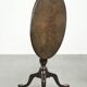Practical round antique English tilt top table from the 18th century