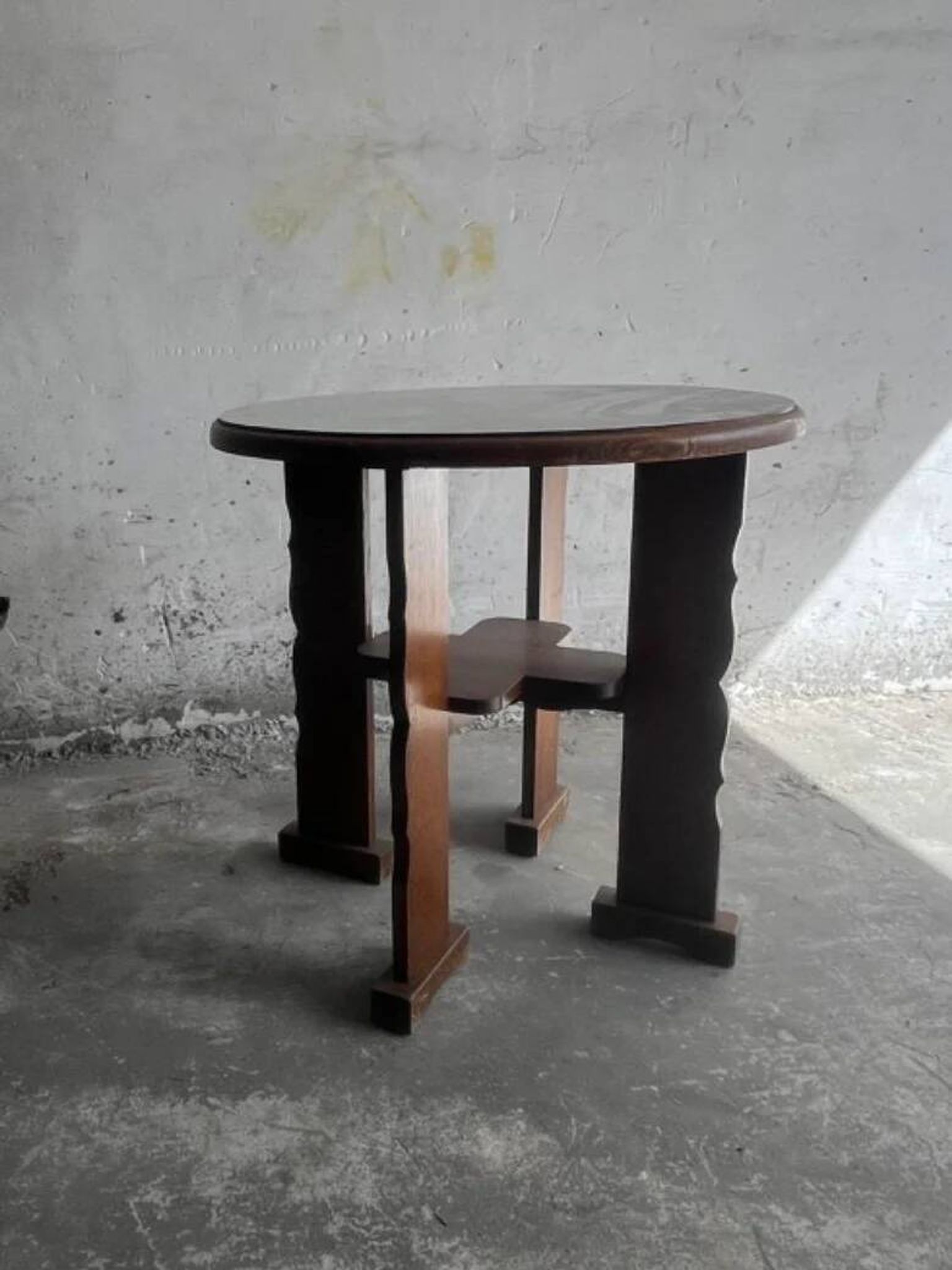 Dark brown solid wood Brutalist round side table, circa 1970, sculptural