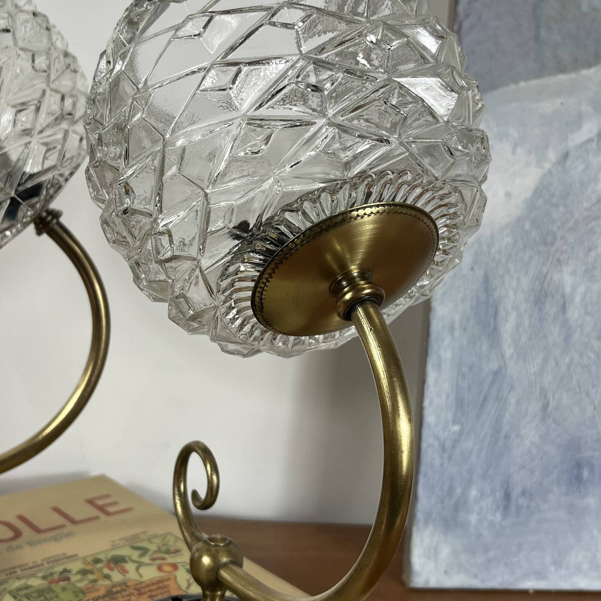 Pair of antique wall sconces with swan necks and glass globes.