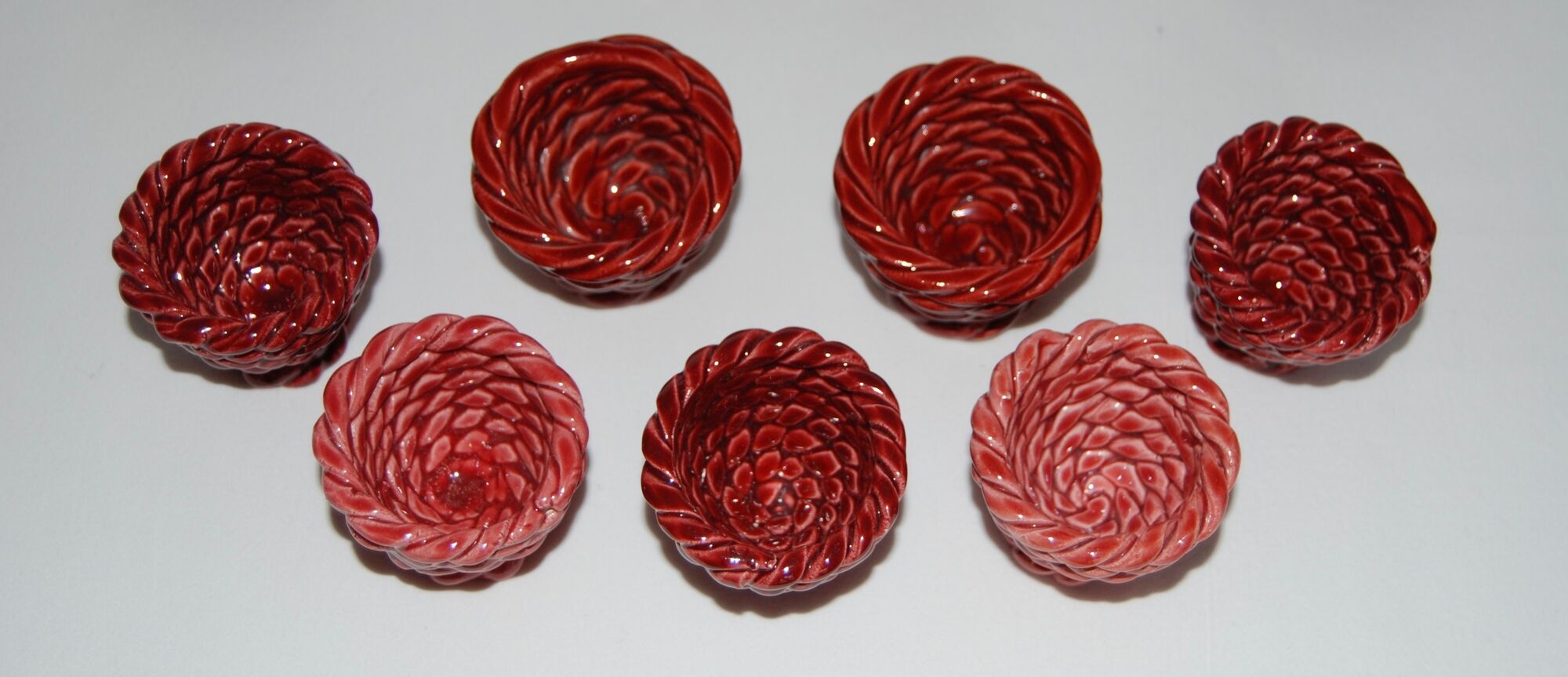 Set of 7 eggcups by Louis Bacculini, Vallauris, with 2 cups of salt, 6 saucers