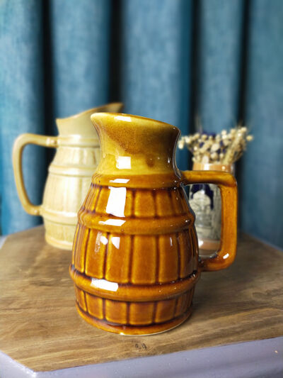 Two pitchers and a small original king beer mug