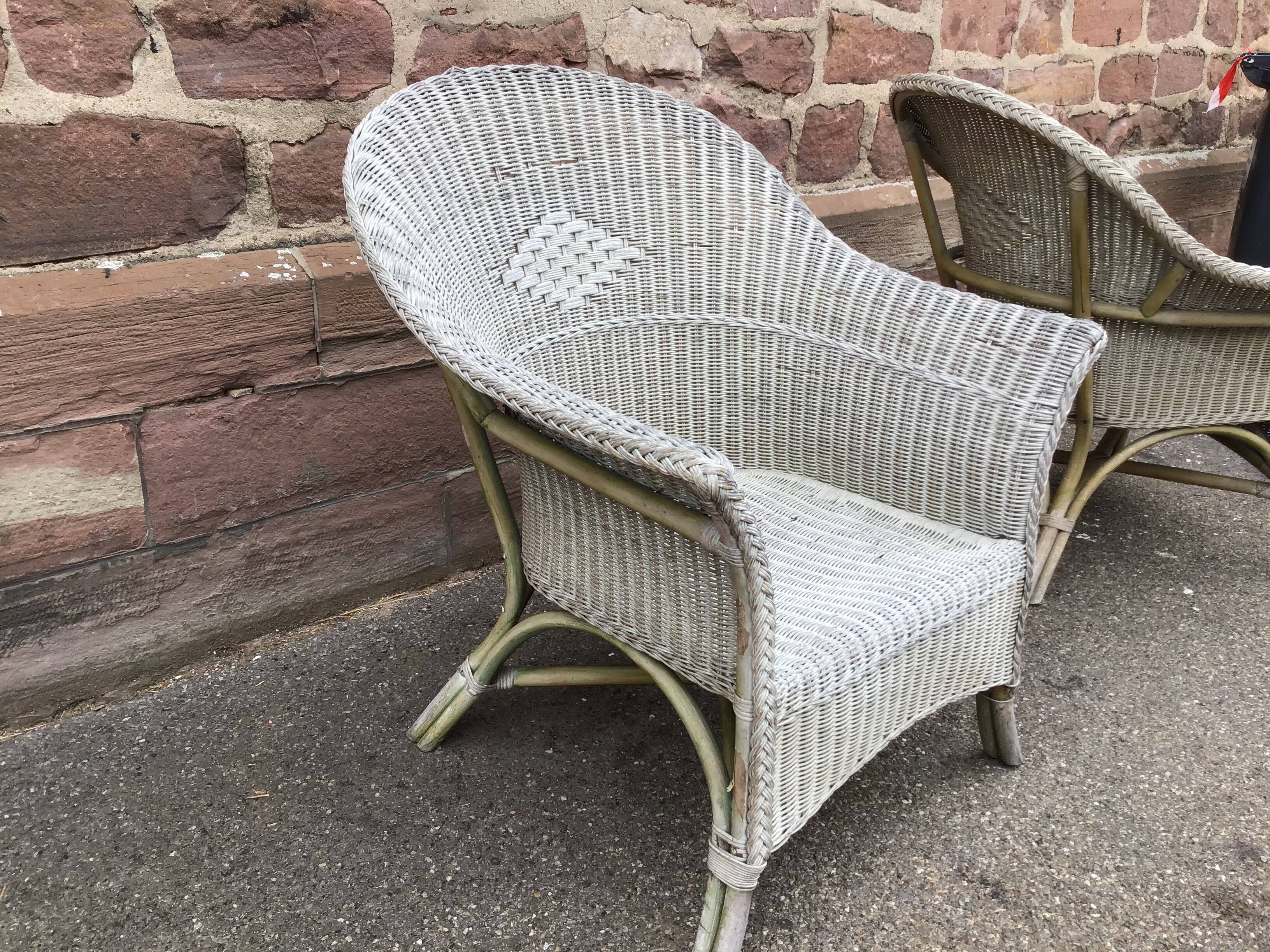 2 vintage grey rattan armchairs from the 60s