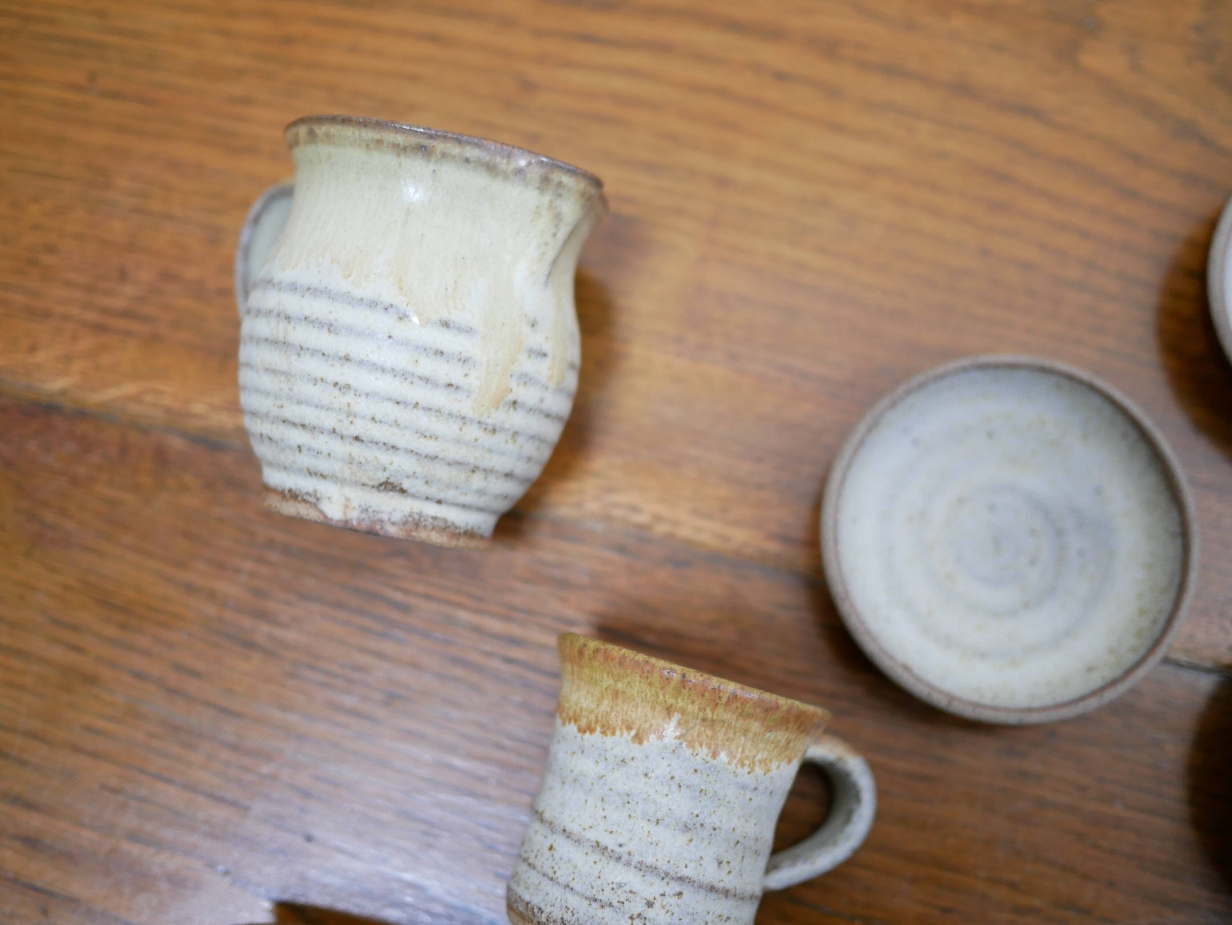 Series of 4 cups and a vintage stoneware milk jug