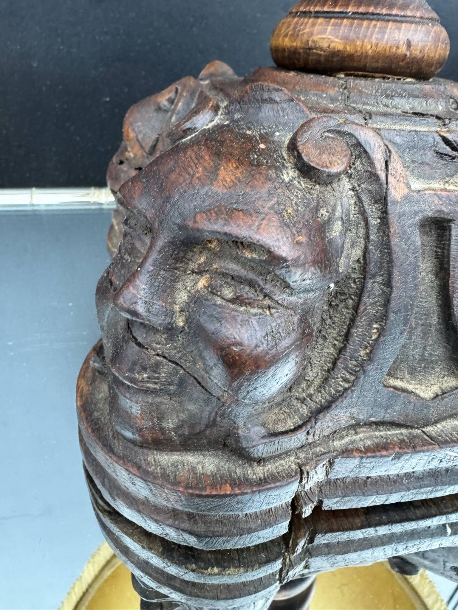 Sculpted wooden lamp with faces, antique.