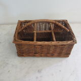 Basket carries glasses or cutlery in wicker.