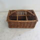 Basket carries glasses or cutlery in wicker.