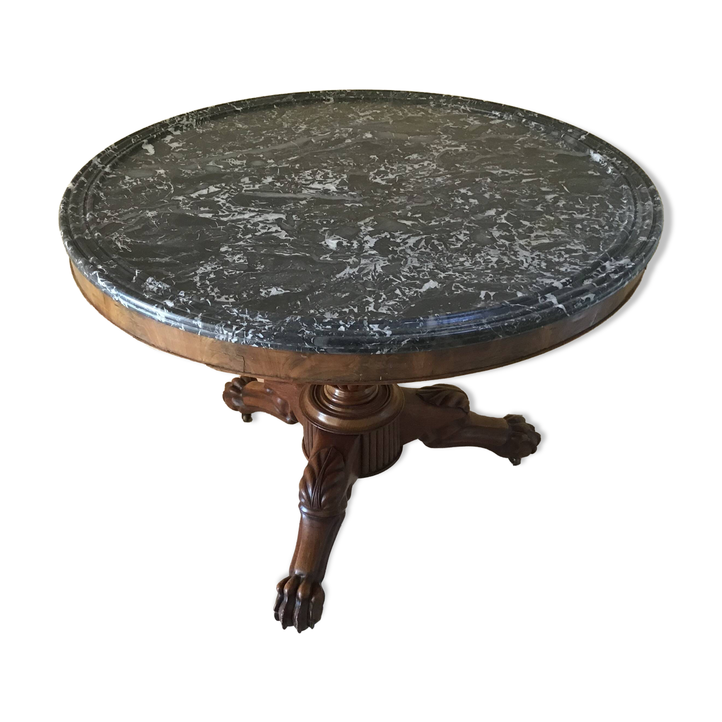 Wooden gueridon with marble, lion paw legs.