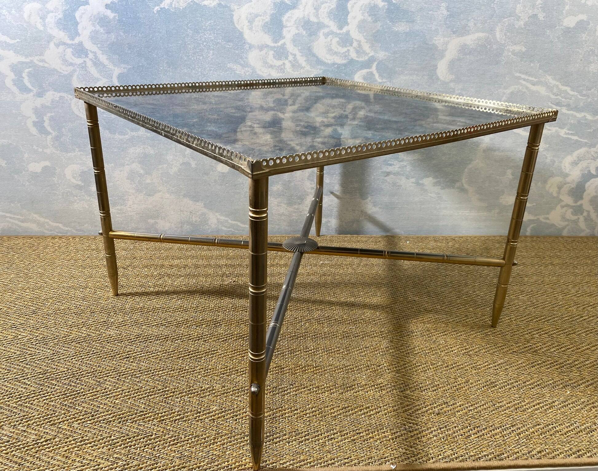 Side table with oxidised metal mirror top on a brass frame, France, 1960s.