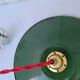 Suspension in green and white enamelled sheet metal