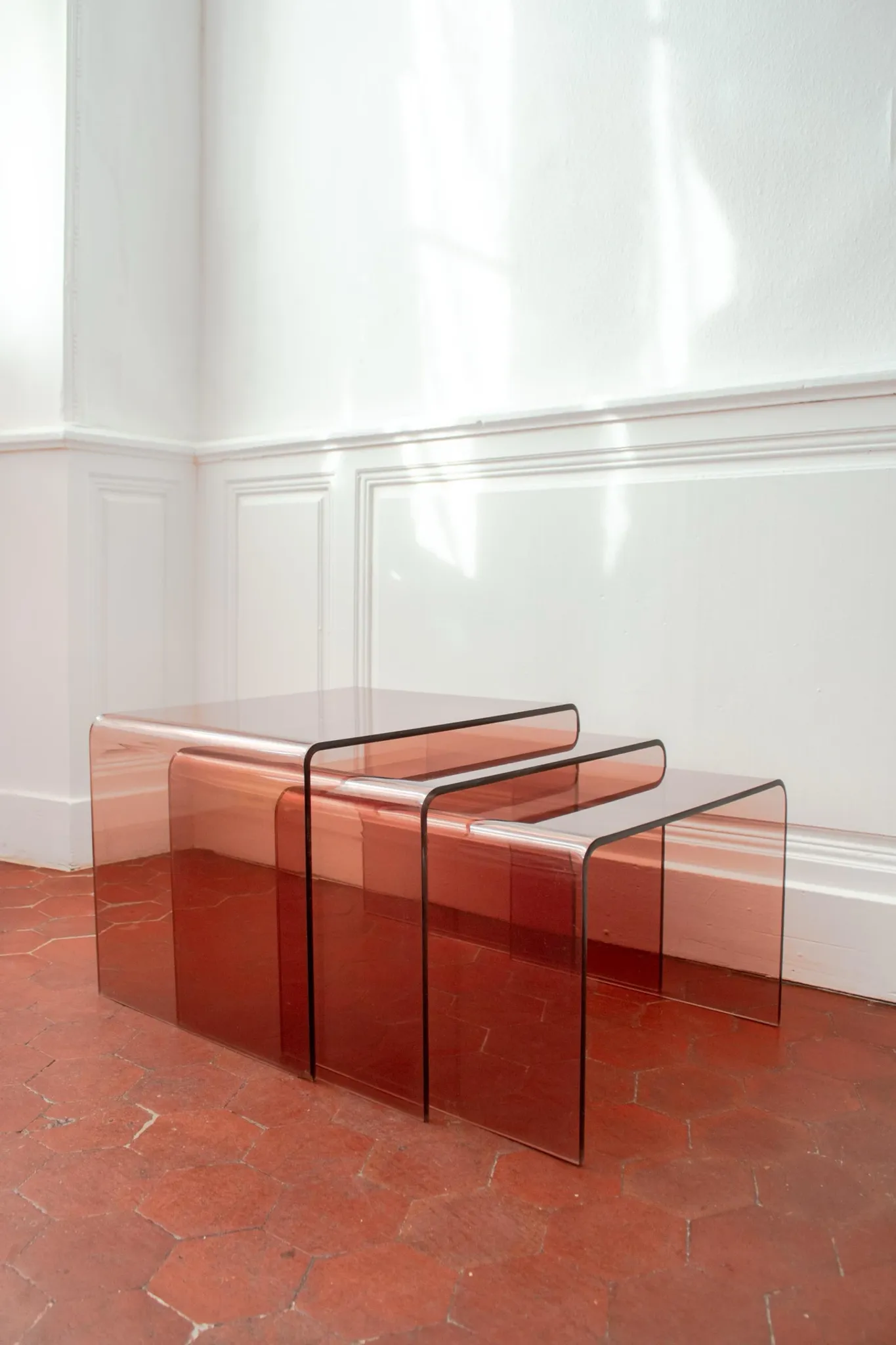 Vintage trio of nesting tables in smoked plexiglass by Michel Dumas, year
