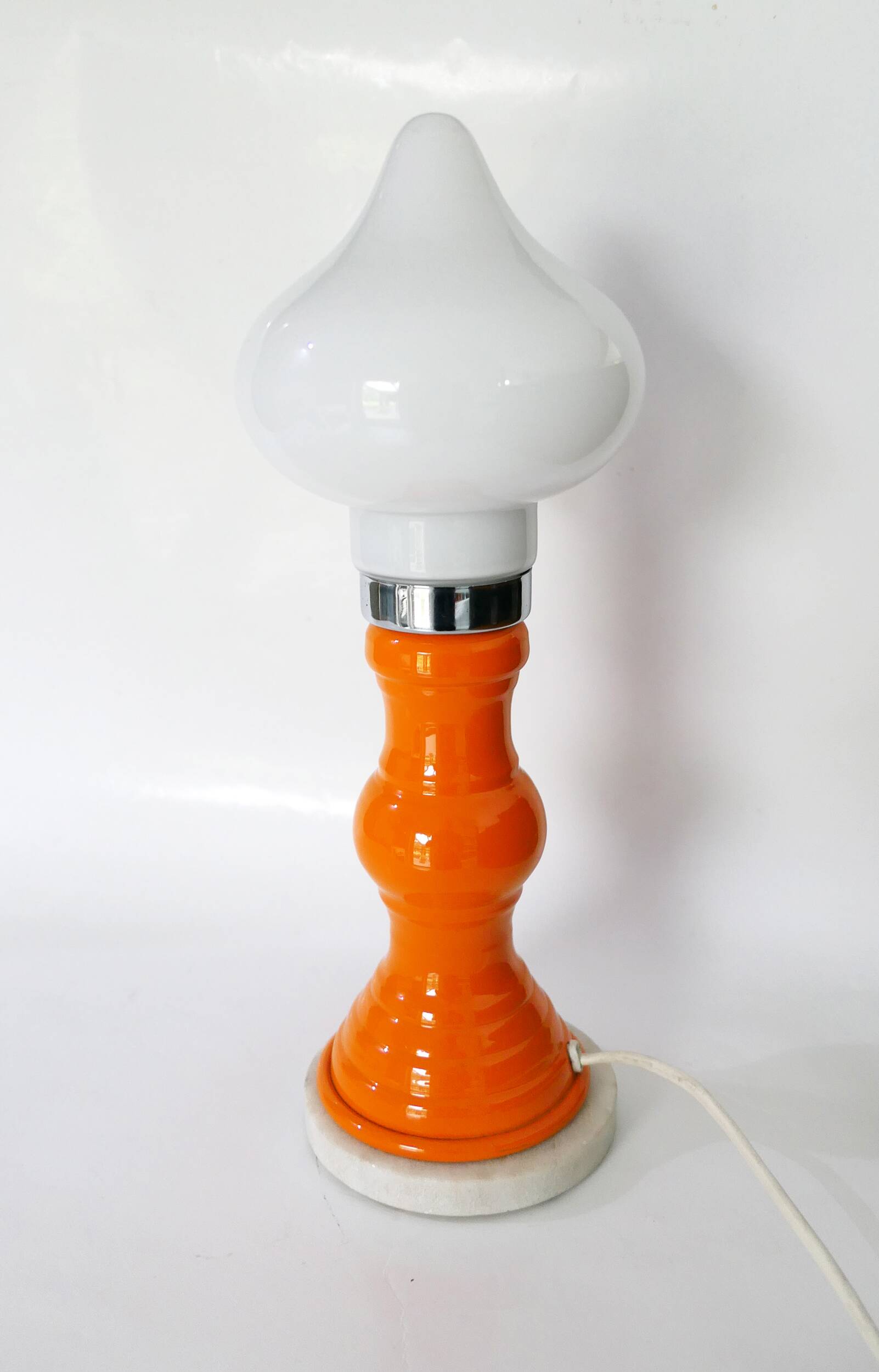 Table lamp or bedside lamp from the 1960s-70s in orange and chrome.