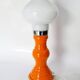 Table lamp or bedside lamp from the 1960s-70s in orange and chrome.
