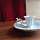 Antique handheld candle holder in porcelain