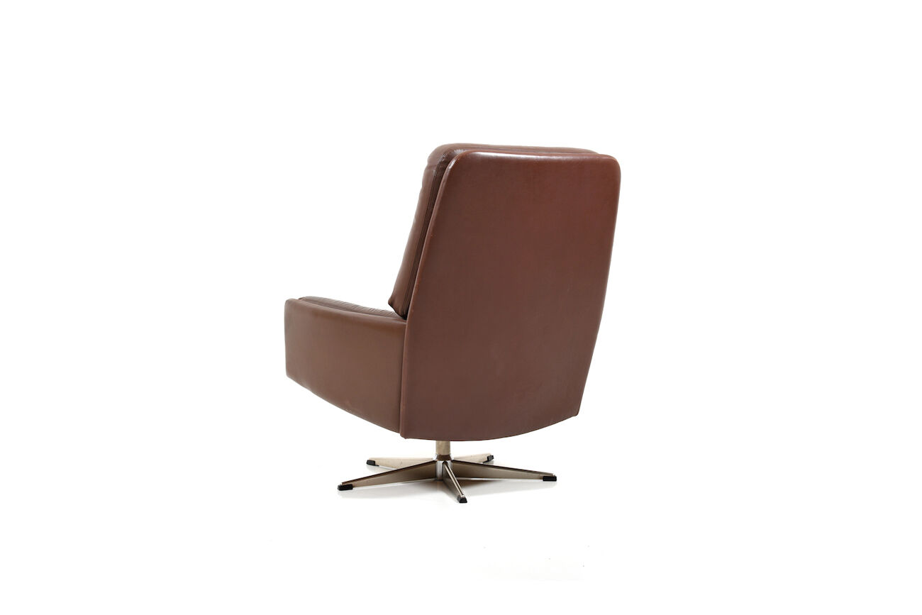 Danish swivel lounge chair in brown leather