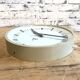 Beige industrial bakelite wall clock from Pragotron, 1970s