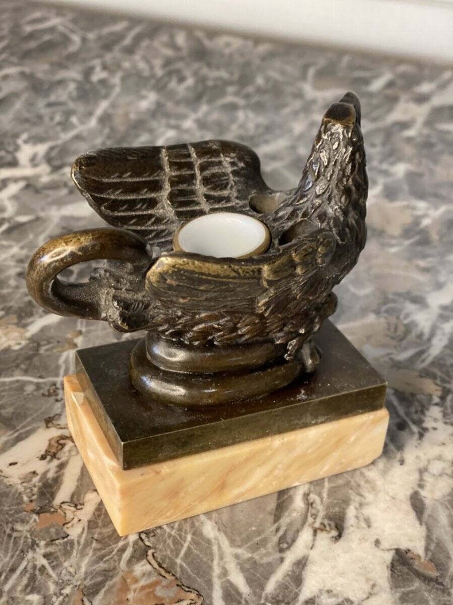 Eagle and serpent, bronze inkwell on a marble base.