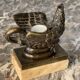 Eagle and serpent, bronze inkwell on a marble base.