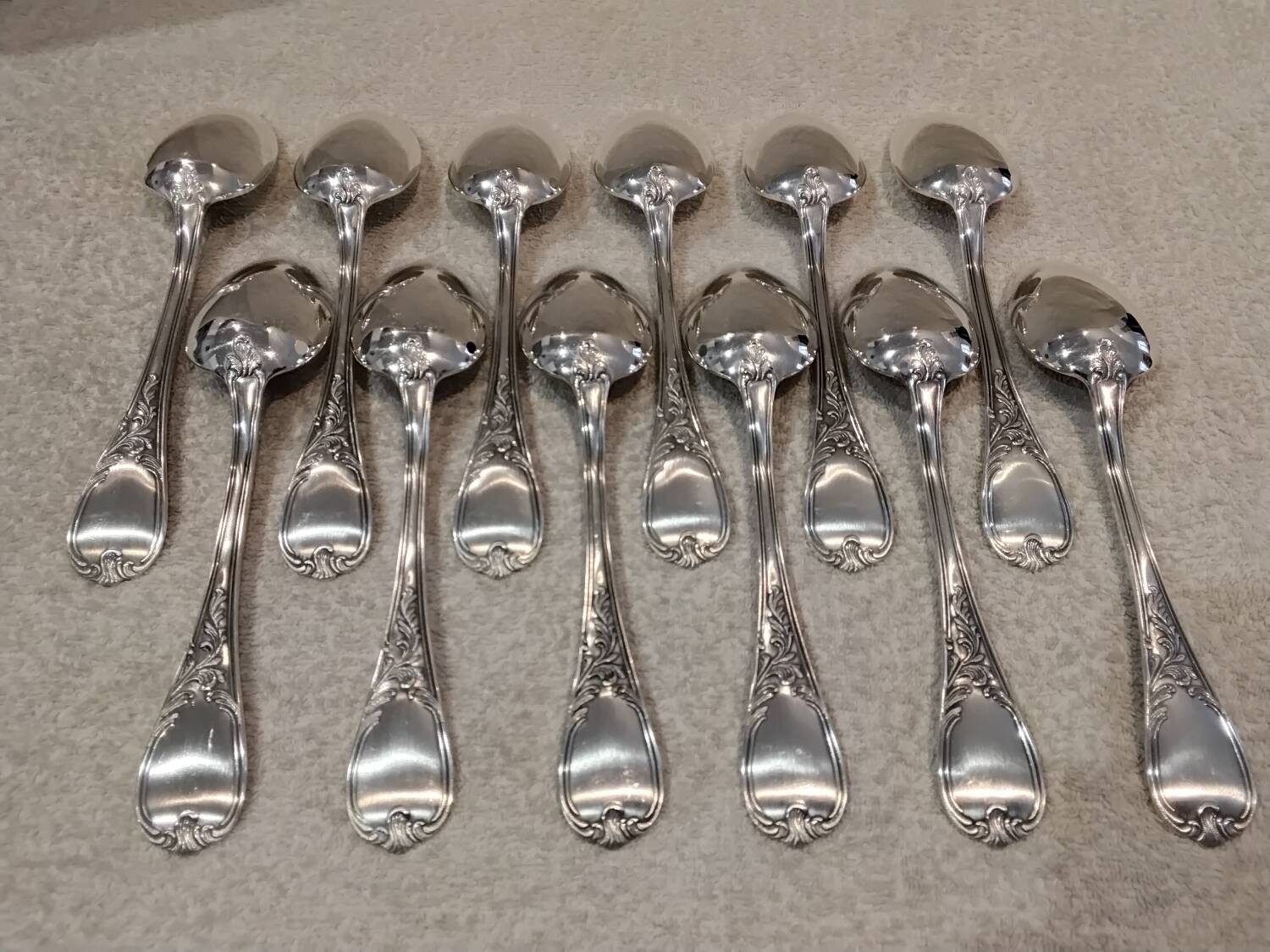 12 silver-plated metal soup spoons, Ercuis Dubarry model.