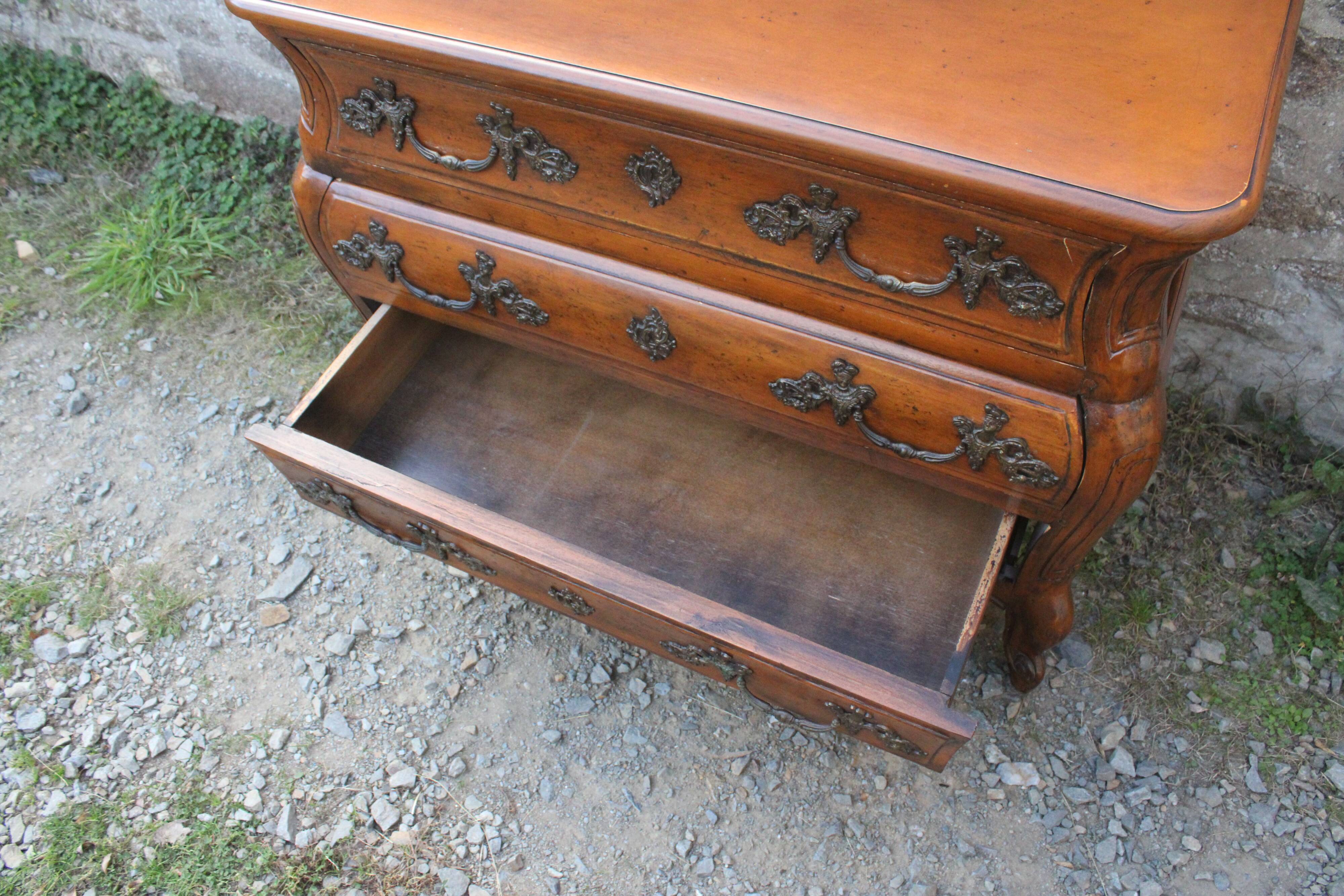 Curved Louis XV style chest of drawers known as a “tomb”