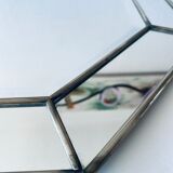 Old octagonal beveled mirror with parcloses