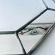 Old octagonal beveled mirror with parcloses