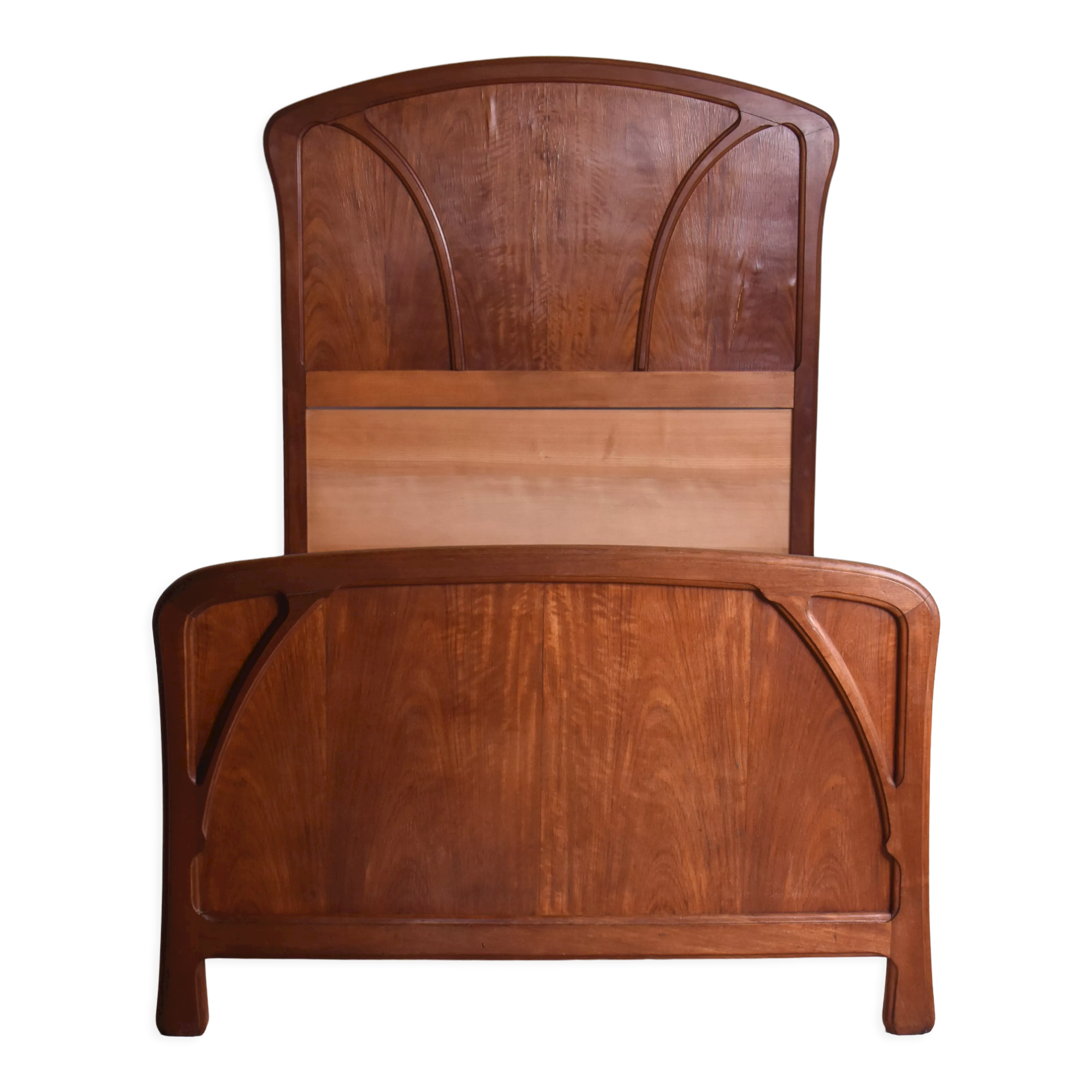 Wooden bed, early 20th century.