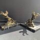 Pair of art deco marble and patinated regulated bookends