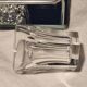 Baccarat 7 crystal liqueur glasses signed Model Harcourt on a stand.